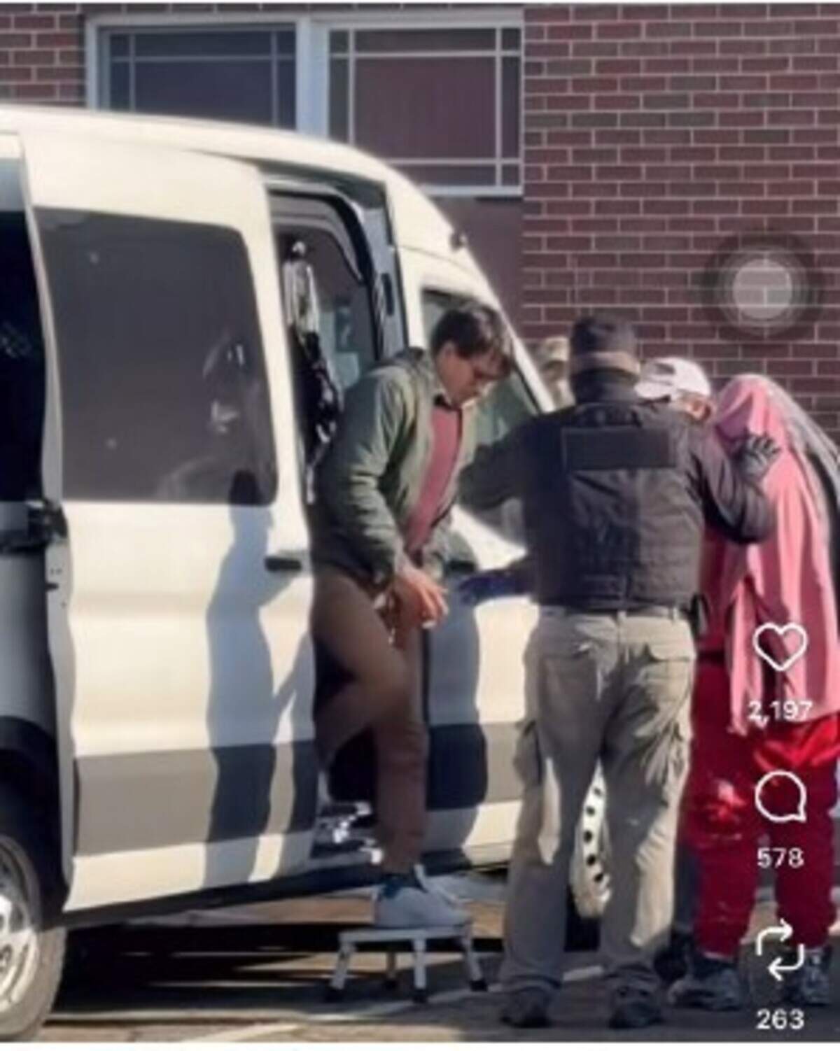 Juan Sebastián Carvajal-Muñoz, in handcuffs, being transferred to the Kittery, Maine, police station.