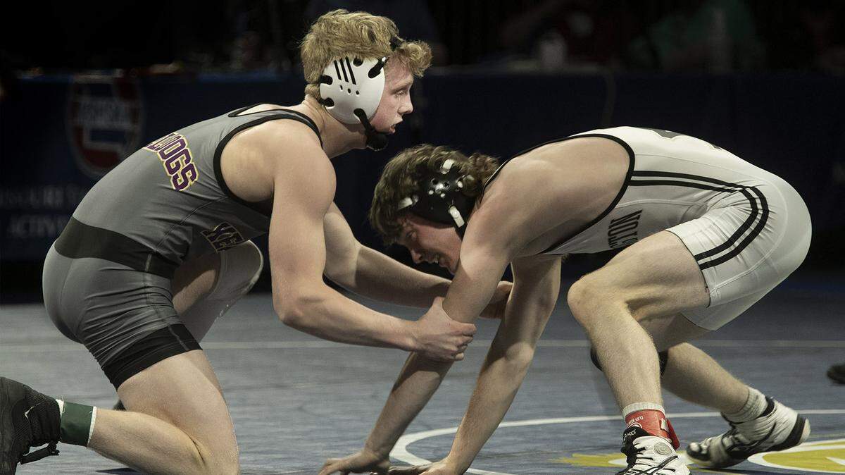 Eli Ashcroft (left), of Kearney threw Blake Cook of Farmington in the 132 lb weight class at the MSHSAA class 3 Wrestling Championships, Friday, March, 12, 2021 at Cable Dahmer Arena, Independence. Ashcroft won the match.