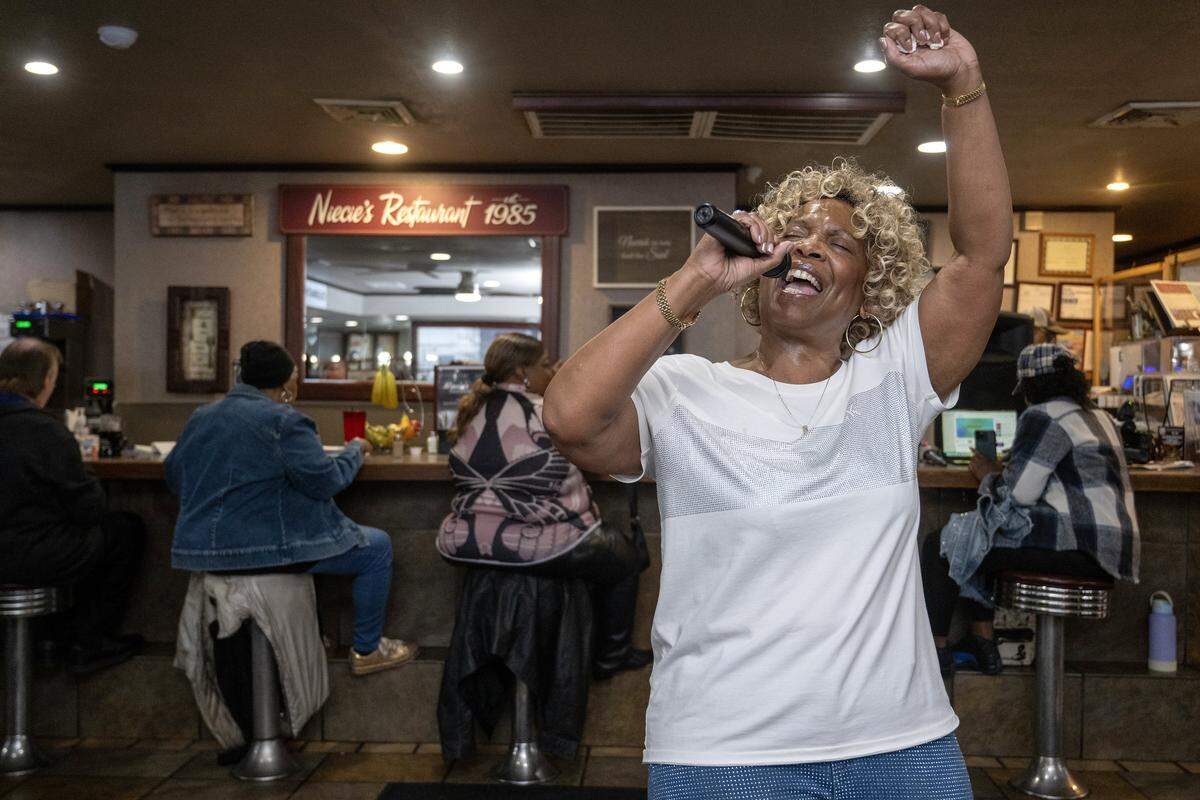 Denise “Ms. Niecie” Ward belts out a song during “Dinner & A Show” on Friday, Feb. 6, 2026, at Niecie's Restaurant in Kansas City. Ward performs on the First Friday of every month at her soul food restaurant.
