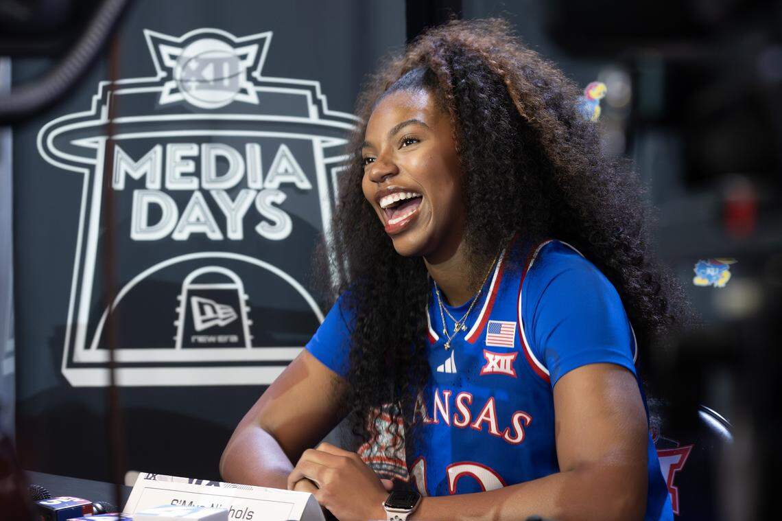 Kansas Jayhawks guard S'Mya Nichols (12) smiles while addressing reporters during one-on-one interviews at Big 12 Media Days at T-Mobile Center on Tuesday, Oct. 21, 2025, in Kansas City.