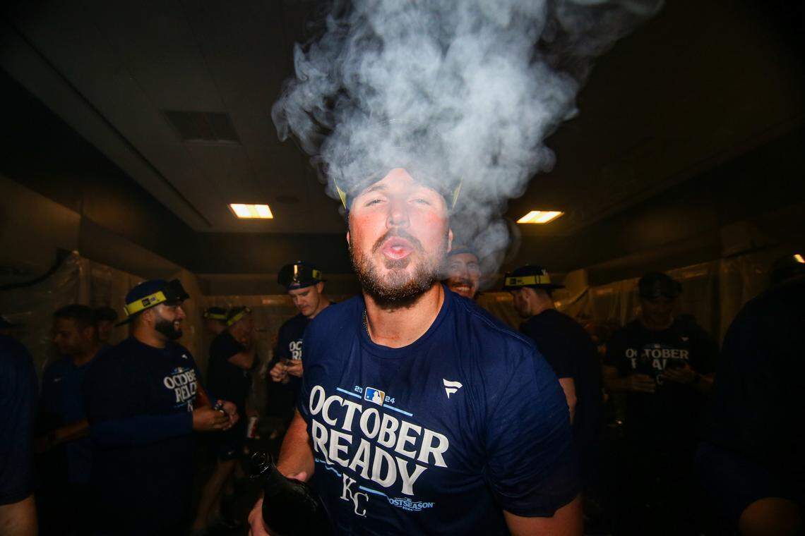 Kansas City Royals right fielder Hunter Renfroe (16) celebrates after clinching a wild card playoff birth after a game against the Atlanta Braves at Truist Park. Mandatory Credit: Brett Davis-Imagn Images