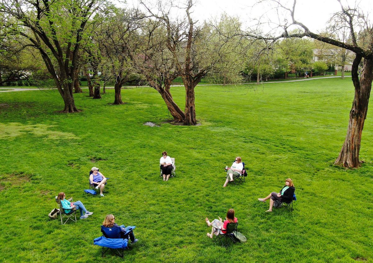 Unlike the crowds gathering at school athletic fields, this group followed social-distancing guidelines on Sunday at Franklin Park in Prairie Village.
