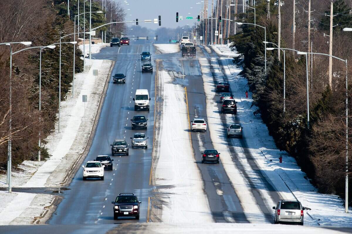 State Line Road shows how well streets are plowed after a winter storm. The Kansas side was cleared, but the Missouri side still had snow.
