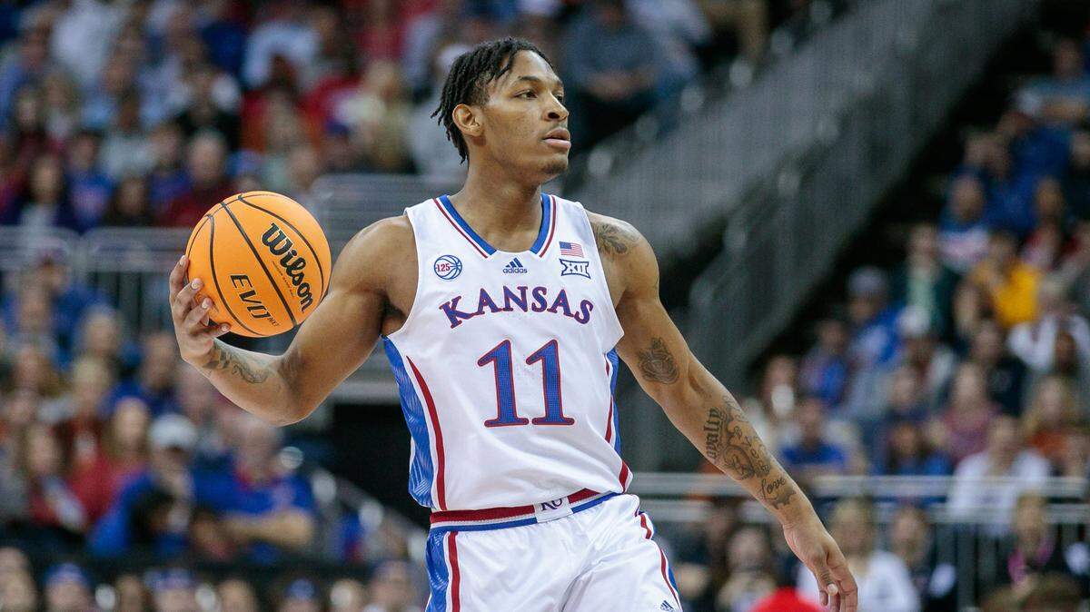Kansas Jayhawks guard MJ Rice (11) sets the play during the first half against the Texas Longhorns at T-Mobile Center in Kansas City on March 11, 2023.