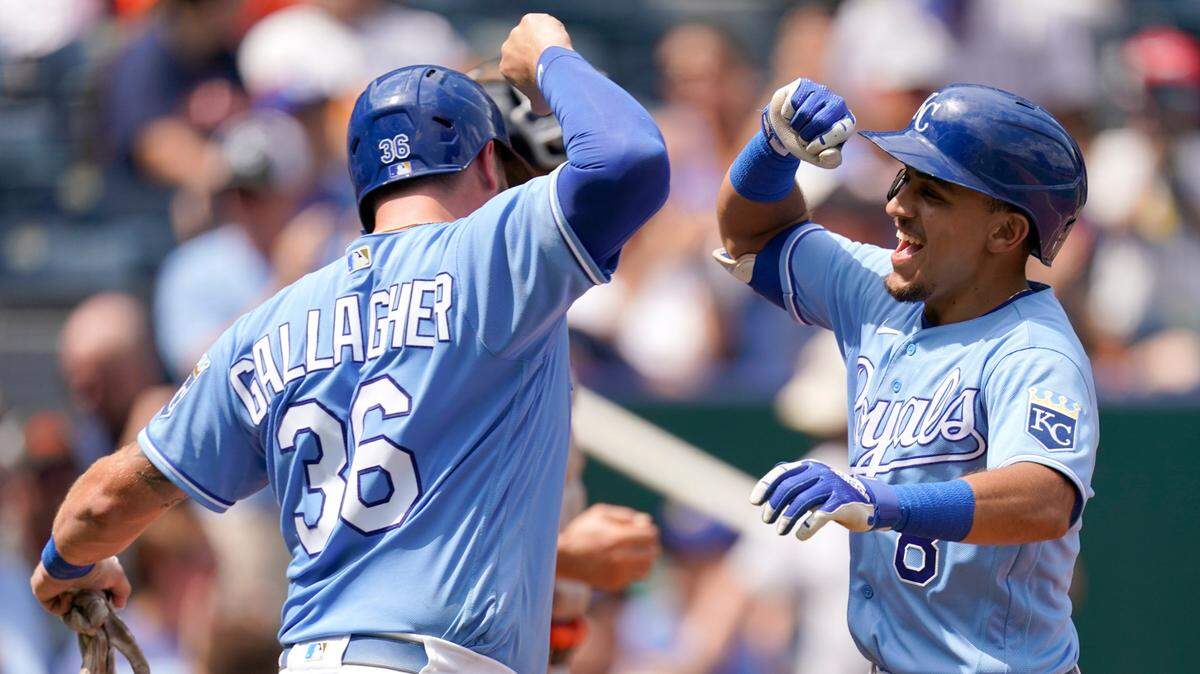 The Royals’ Nicky Lopez (right) celebrates with Cam Gallagher after Lopez hit a two-run home run during the third inning against the Houston Astros on Thursday, Aug. 19, 2021, at Kauffman Stadium in Kansas City, Mo.