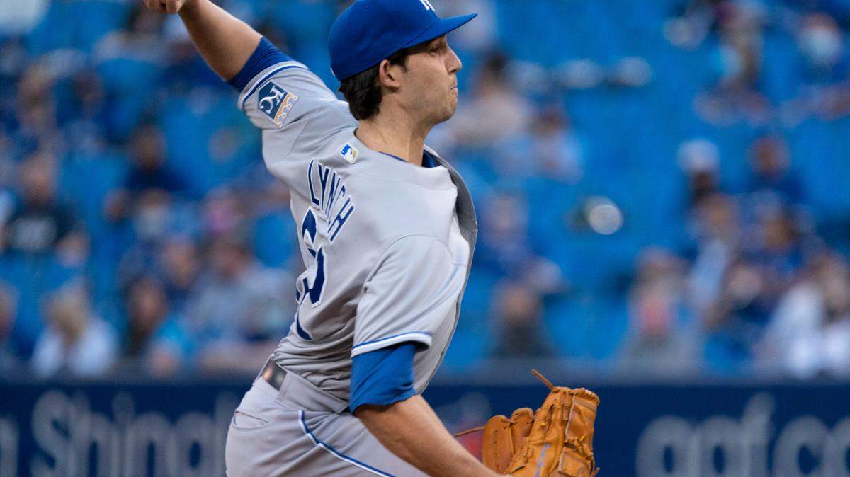 Kansas City Royals pitcher Daniel Lynch throws to a Toronto Blue Jays batter during the first inning of a baseball game Friday, July 30, 2021, in Toronto. The Blue Jays were playing in Toronto for the first time since the COVID-19 pandemic began. (Peter Power/The Canadian Press via AP)