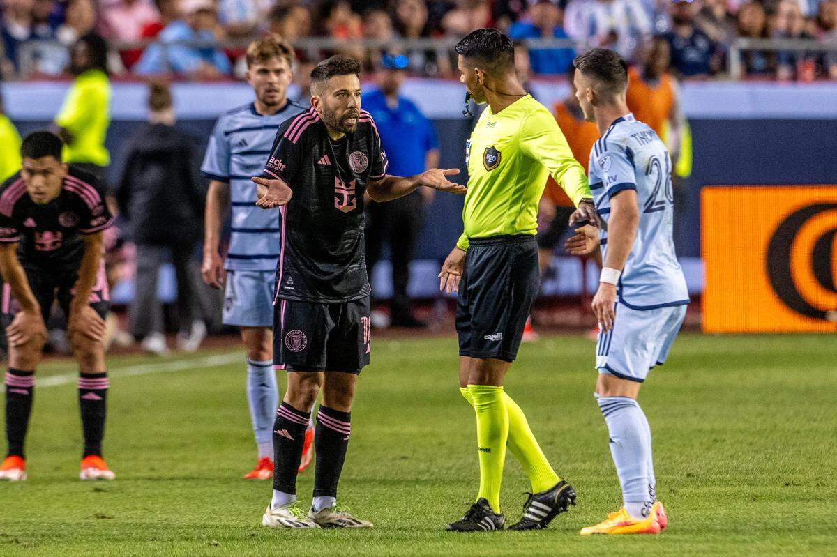 Inter Miami defender Jordi Alba (18) disputes a call with the referee during the second half of an MLS match against Sporting Kansas City at GEHA Field at Arrowhead Stadium, Saturday, April 13, 2024, in Kansas City.