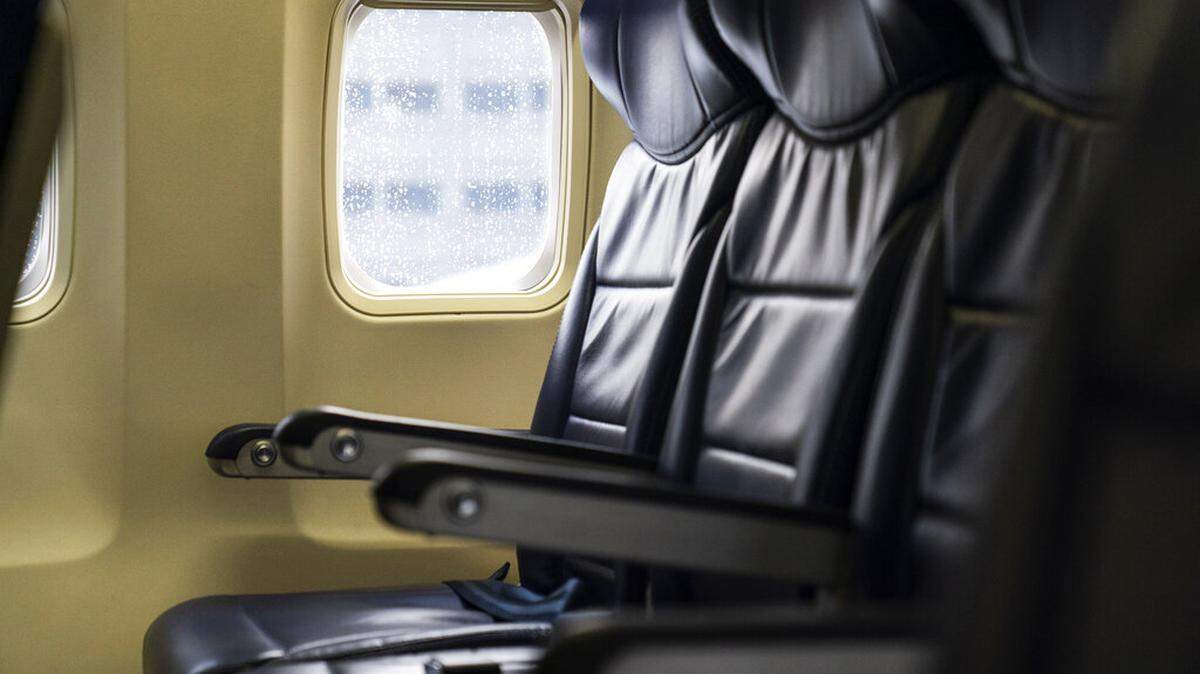 Seats are vacant aboard a Southwest airplane before it takes off on a flight from Providence, R.I. to Orlando, Fla., Wednesday, April 21, 2021. (AP Photo/David Goldman)