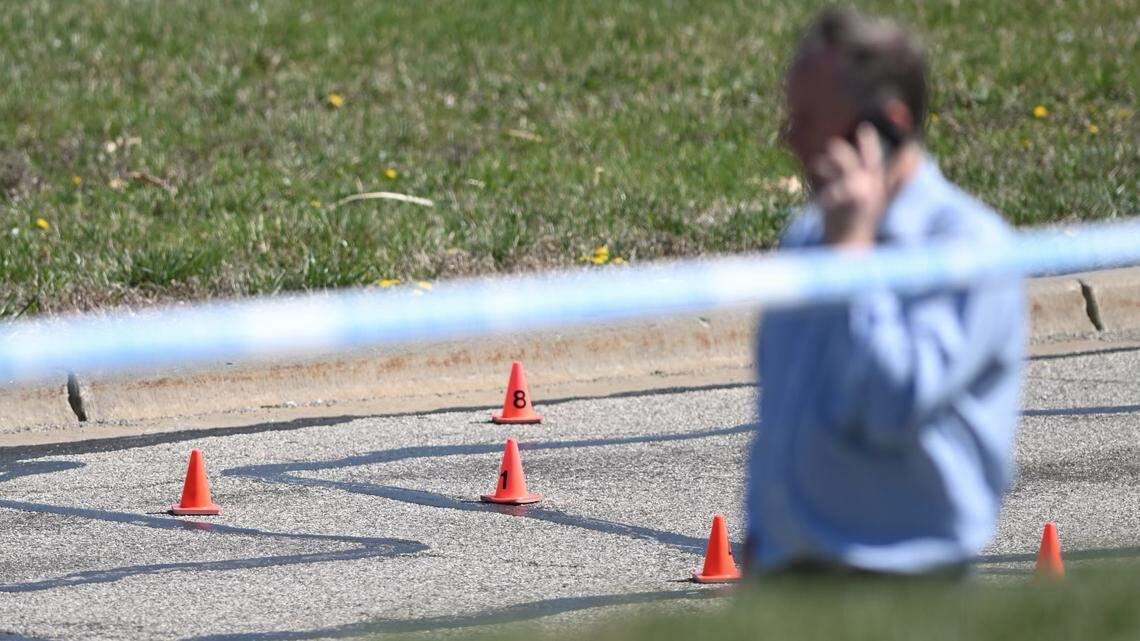 A police officer was shot near North Ambassador Drive and NW Polo Drive last month in the Tiffany Springs area. Cones marked shell casings on the street at the scene of the shooting.