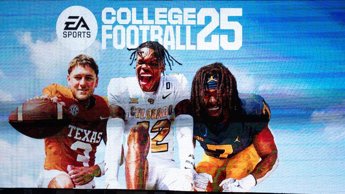 A commercial for the College Football 25 video game, featuring Texas quarterback Quinn Ewers plays during the fifth inning of the Longhorns’ baseball game against the Kansas Jayhawks, Thursday, May 16, 2024 at UFCU Disch-Falk Field in Austin.