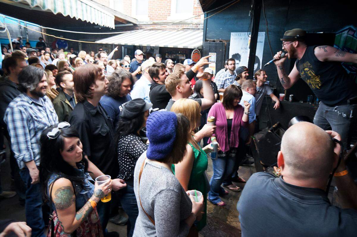 Cherokee Rock Rifle perform on the patio of the Riot Room in 2012. The venue closed in October.