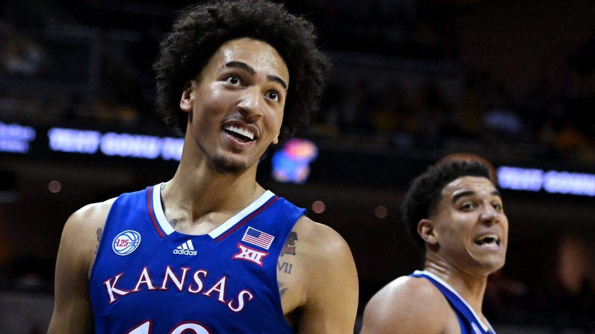 With the game well in hand, KU’s Jalen Wilson, left, and teammate Kevin McCullar exchange pleasantries with the MU student section during the second half of a Dec. 10, 2022 game at Mizzou Arena.