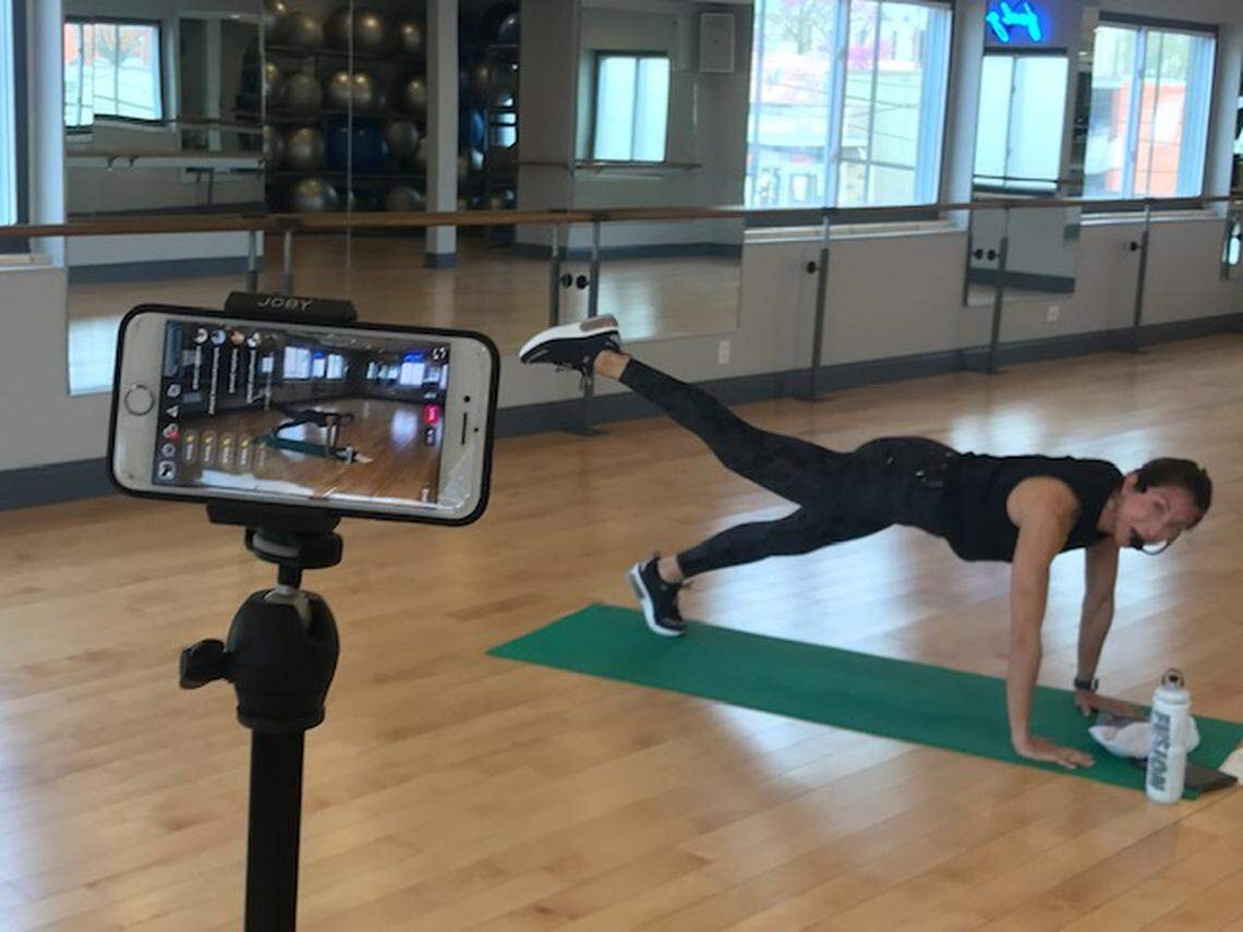 The studio at Fusion Fitness in downtown Overland Park is typically packed for morning classes with 50 to 60 women. The COVID-19 shutdown has left it empty. To keep members engaged, fitness instructor Erica Creger teaches free 9 a.m. and 11 a.m. fitness classes over Instagram Live. On Tuesday, 75 people followed online.