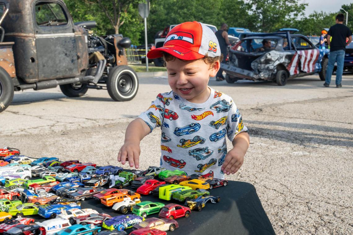 Myles Sauer, 2, gets excited looking at a table full of Hot Wheels cars at the Kansas City stop of the Hot Wheels Legends Tour. Myle’s dad, Dylan, says he’s always loved cars and he’s happy that he could pass that love down to his son.