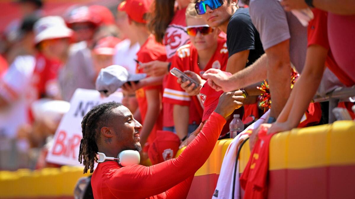 Kansas City Chiefs safety Justin Reid signed autographs for fans before the start of a 2022 preseason game against the Washington Commanders at GEHA Field at Arrowhead Stadium.