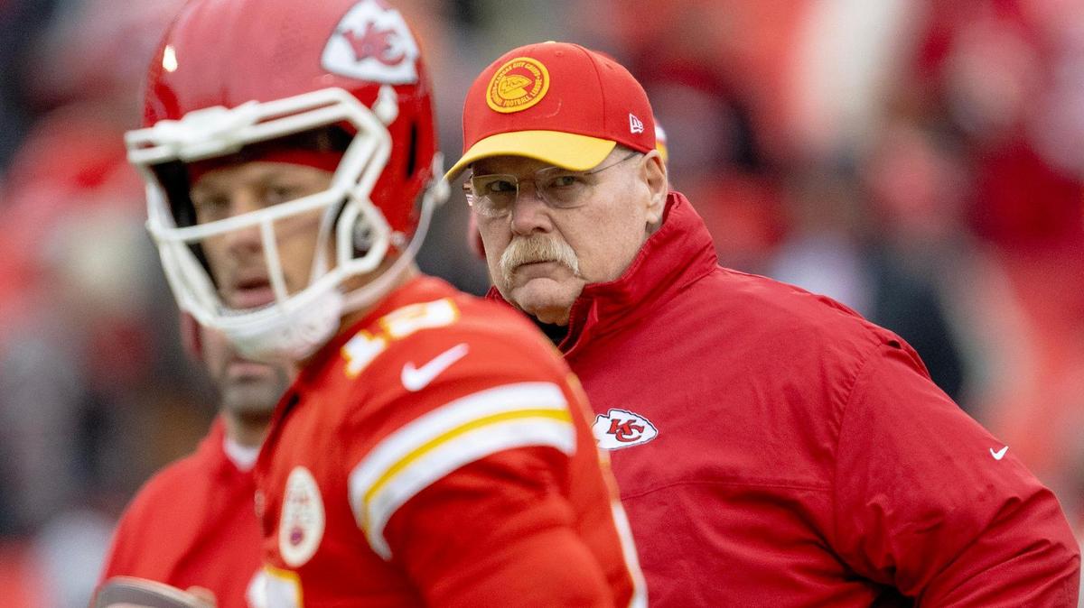 Kansas City Chiefs head coach Andy Reid watches quarterback Patrick Mahomes (15) warm up before an NFL football game against the Cincinnati Bengals at GEHA Field at Arrowhead Stadium on Sunday, Dec. 31, 2023, in Kansas City.