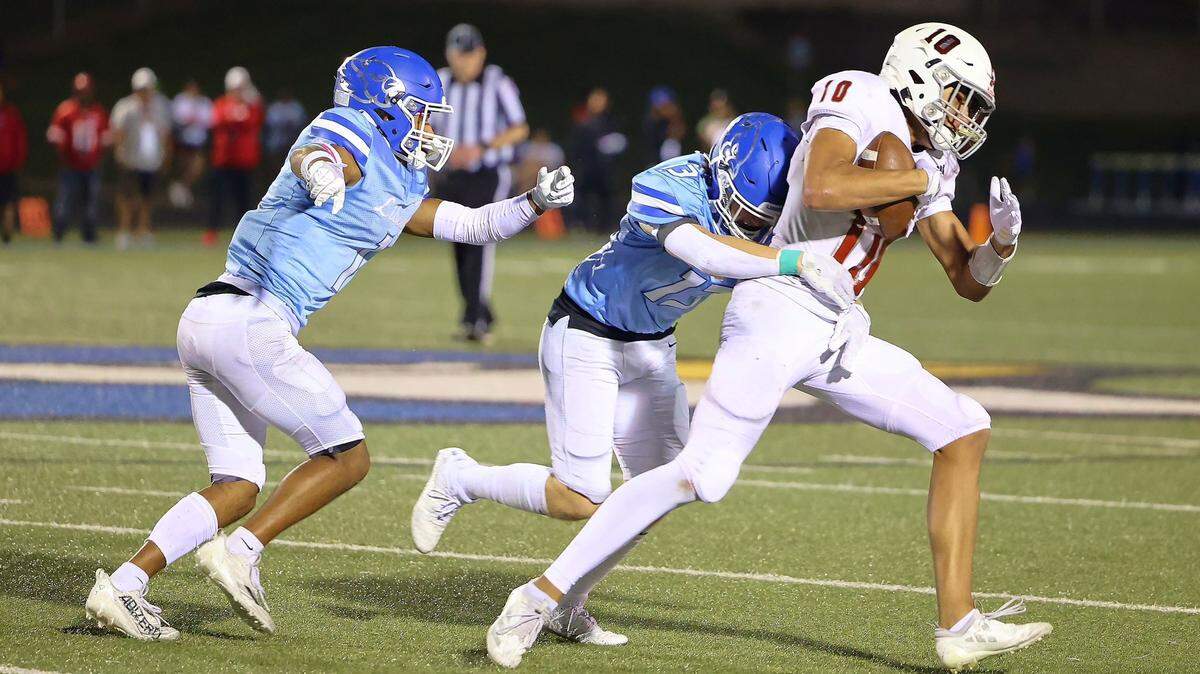 Chad Rader Attachments 11:34 PM (0 minutes ago) to me, Scott Park Hill’s Braylon Agee runs through Liberty defenders during the Trojans’ 21-17 win in a Friday night high school football showdown in Liberty.