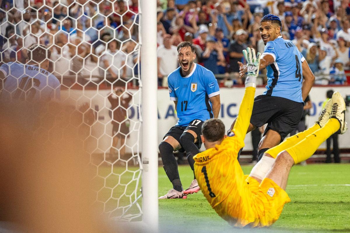 Uruguay players look on as Mathías Olivera (16) scores a goal in the second half of a Copa America match against the United States at GEHA Field at Arrowhead Stadium on Monday, July 1, 2024, in Kansas City.