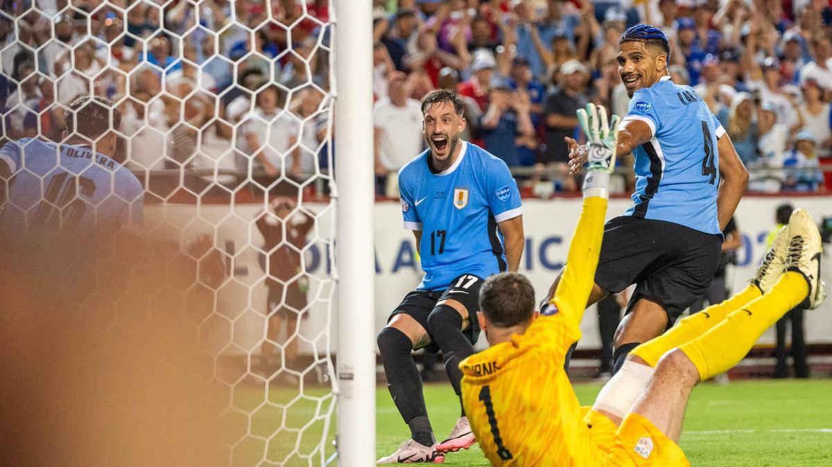 Uruguay players look on as Mathías Olivera (16) scores a goal in the second half of a Copa America match against the United States at GEHA Field at Arrowhead Stadium on Monday, July 1, 2024, in Kansas City.