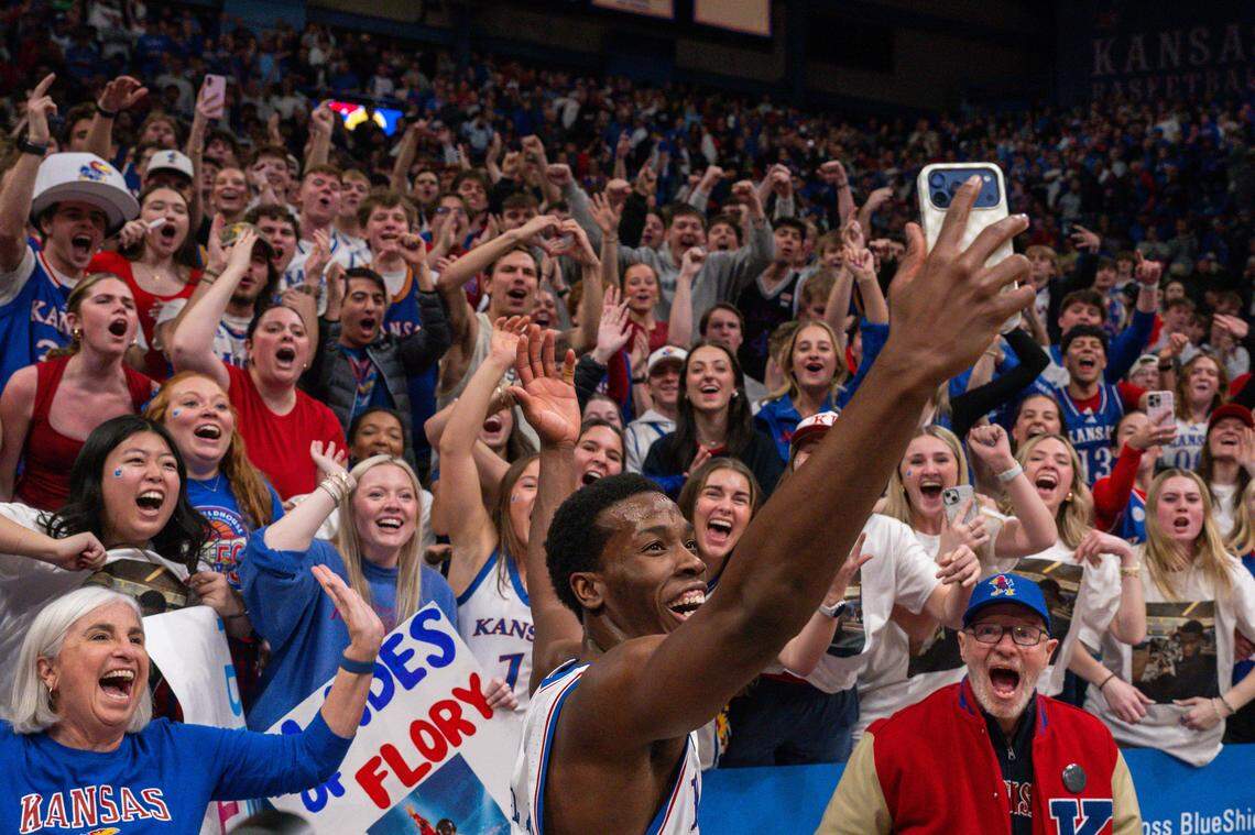 Kansas Jayhawks guard Melvin Council Jr. takes a selfie with the fans following the win vs. the Houston Cougars on Monday, February 23, 2026, at Allen Fieldhouse.
