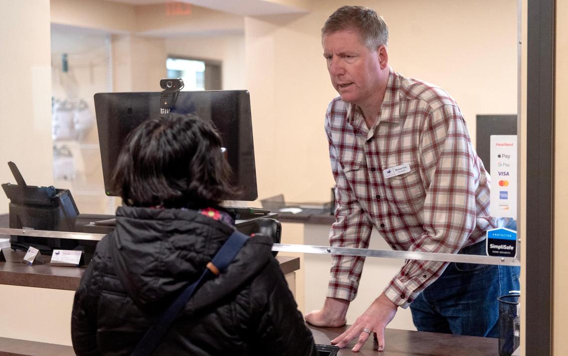 Michael Fink, the pharmacy manager at Pharmacy of Grace, consults with all patients before they leave with their medications to make sure they know how to take them.