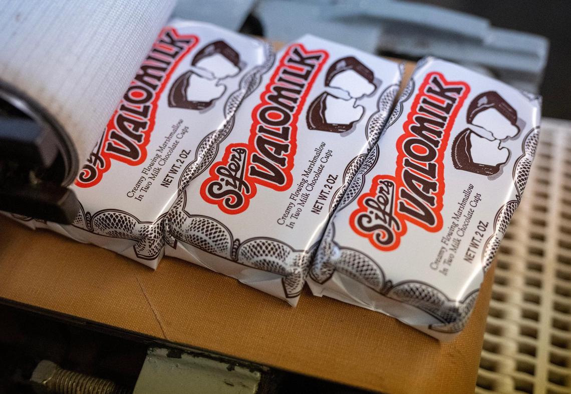Packages of Valomilk candy cups move through the production line toward boxing.