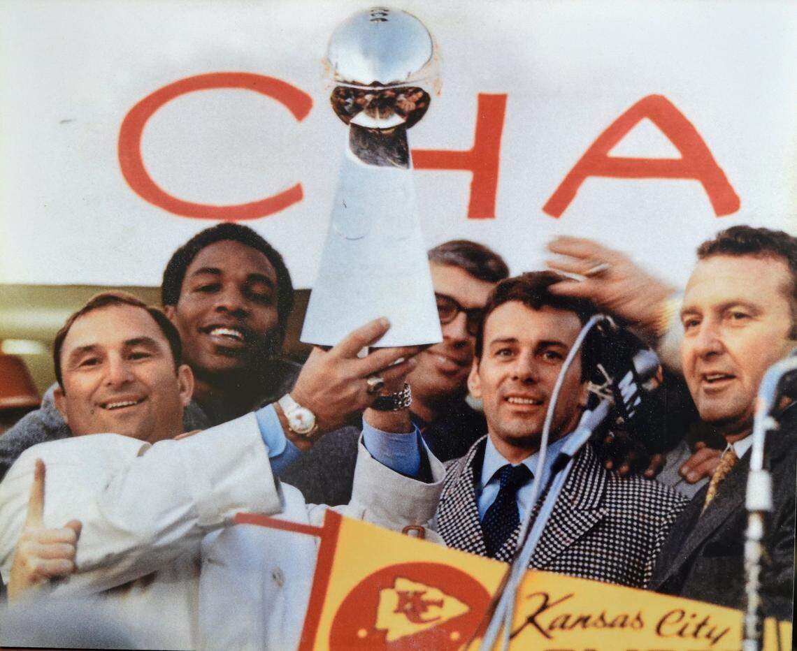 Chiefs quarterback Len Dawson and other members of the 1969 Kansas City Chiefs pose with the Super Bowl trophy in 1970.