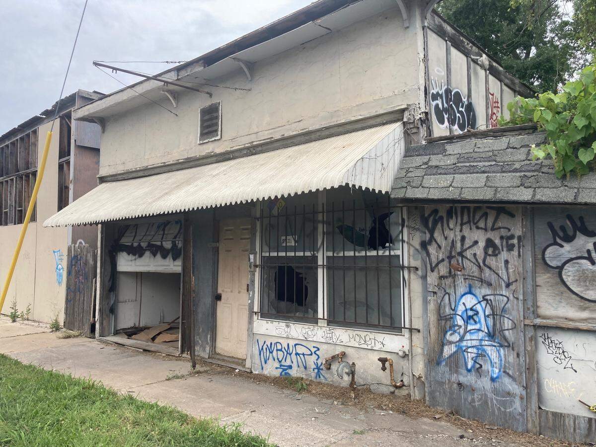 The building on Stadium Drive across from the music clubs Howdy and Farewell sits in neglected disrepair.