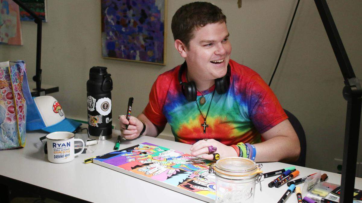 Ryan Sikes works on his art in a studio at the Johnson County Arts and Heritage Center as part of the Emerging Artists program.