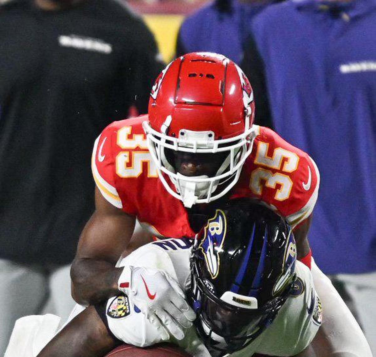 Kansas City Chiefs cornerback Jaylen Watson tackles Baltimore Ravens quarterback Lamar Jackson in the second half Thursday, Sept. 5, 2024, at GEHA Field at Arrowhead Stadium.