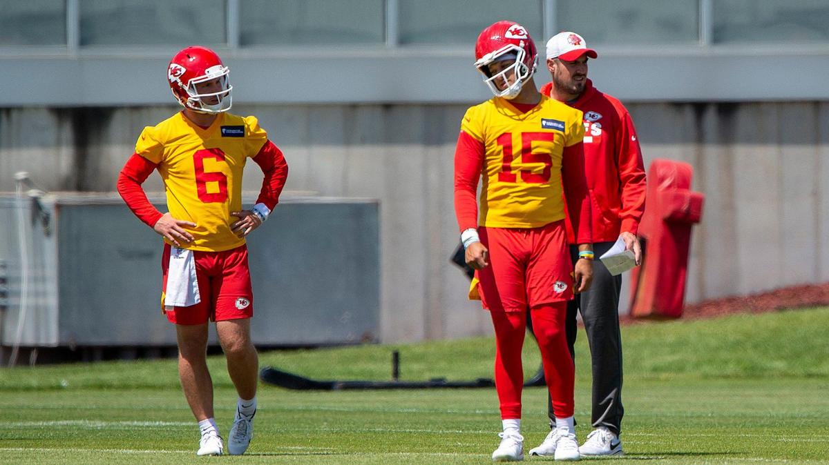 Chiefs’ quarterbacks Shane Buechele (6) and Patrick Mahomes (15) loosened up during day 6 of the Chiefs OTAs at the team’s training facility on Thursday, June 3, in Kansas City.