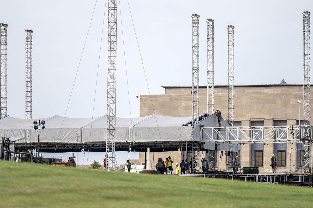 Event staffers set up a stage outside the National WWI Museum and Memorial on Tuesday, Sept. 30, 2025, in Kansas City, ahead of pop singer Chappell Roan's concert Visions of Damsels and Other Dangerous Things.