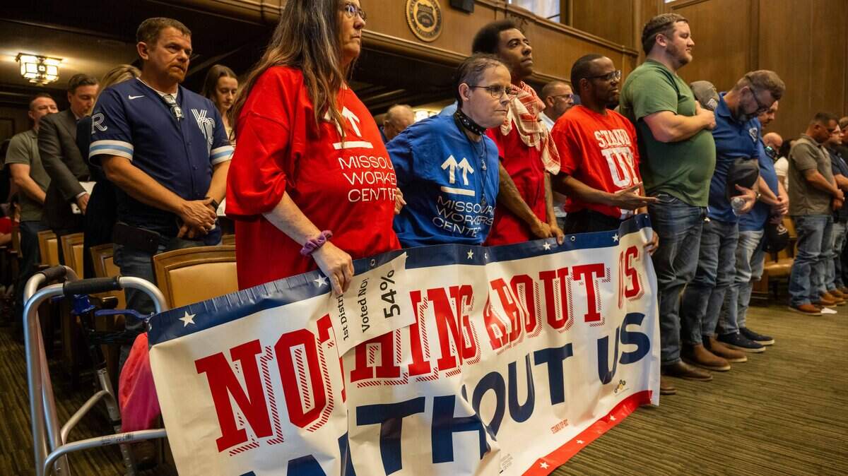 Members of Stand Up KC attend a City Council meeting ahead of a vote on the potential relocation of the Kansas City Royals baseball stadium to the downtown area, on Thursday, April 16, 2026.