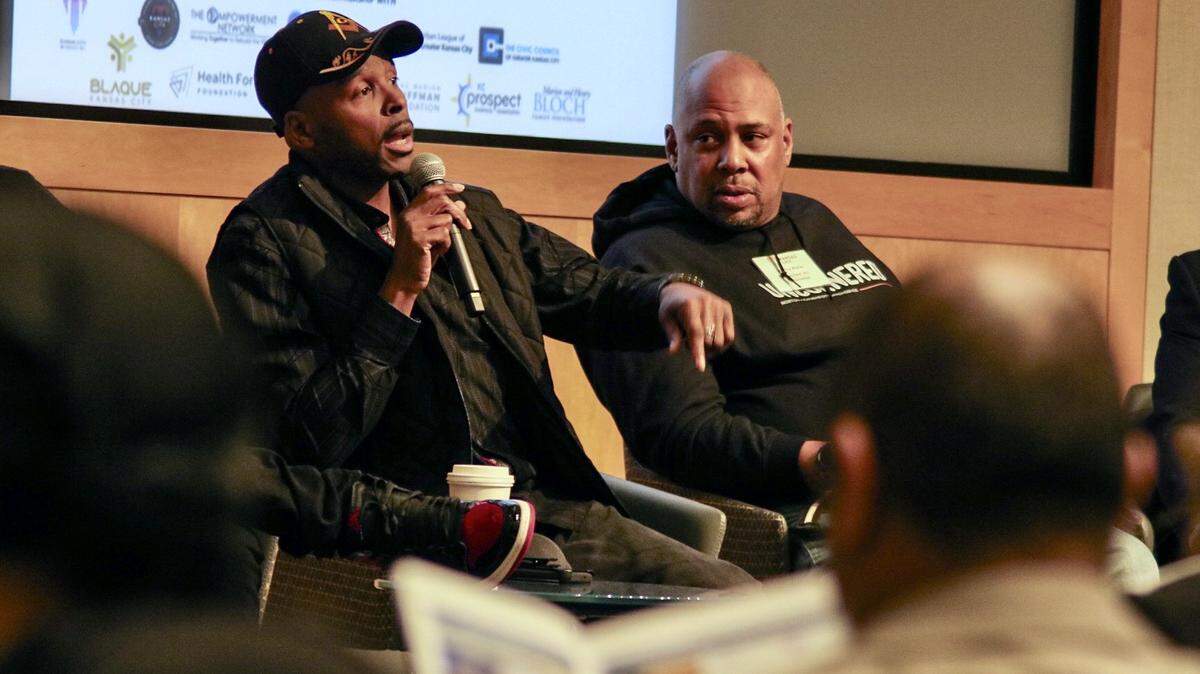 Ossco Bolton, left, and Johnny Waller participate on a panel of lived experiences in violence at a public safety symposium at the Kauffman Foundation Conference Center March 15, 2024.