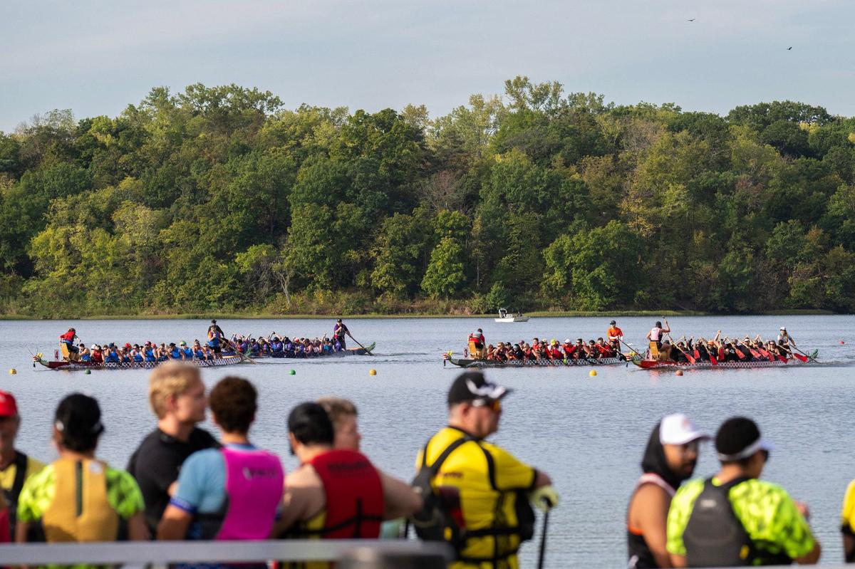 Participants wait near the marina to qualify for races during the KC Dragon Boat Festival on Saturday, Sept. 28, 2024, at Shawnee Mission Park.
