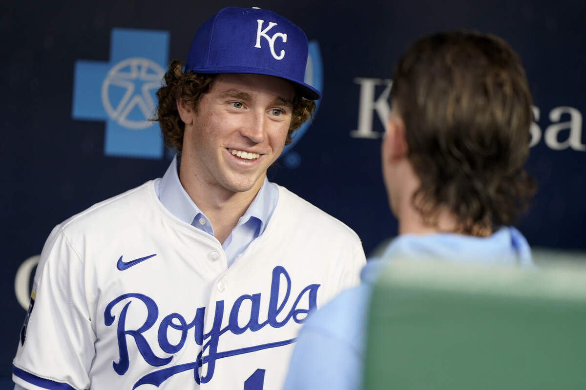 Sean Gamble the Kansas City Royals' pick in the MLB Draft talks with Bobby Witt Jr. #7 of the Kansas City Royals prior to a game between the Cleveland Guardians at Kauffman Stadium on July 25, 2025 in Kansas City, Missouri.