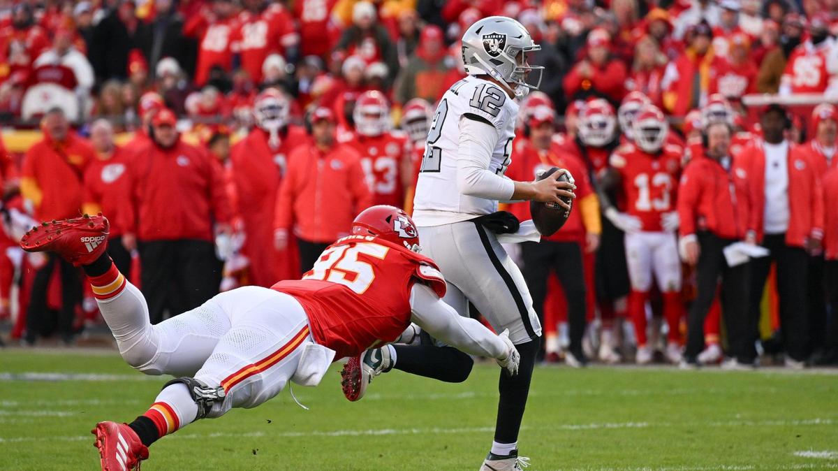 Kansas City Chiefs defensive tackle Chris Jones (95) dives for Las Vegas Raiders quarterback Aidan O’Connell (12) in the second quarter on Friday, Nov. 29, 2024, at GEHA Field at Arrowhead Stadium.
