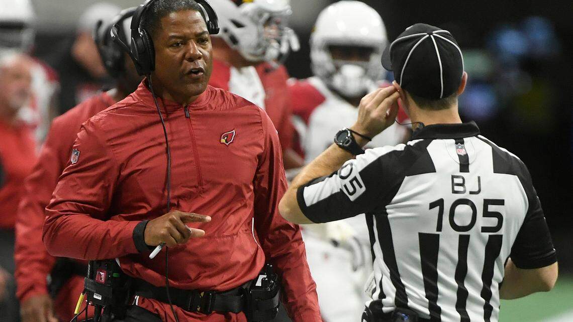 FILE - In this Dec. 16, 2018, file photo Arizona Cardinals head coach Steve Wilks speaks to field judge Rick Patterson (15) during the first half of an NFL football game in Atlanta. The Arizona Cardinals have fired Wilks after just one season as head coach. Wilks’ firing Monday, Dec. 31 followed a 3-13 season, the franchise’s worst record in 18 years and the worst in the NFL this season. (AP Photo/John Amis, File)