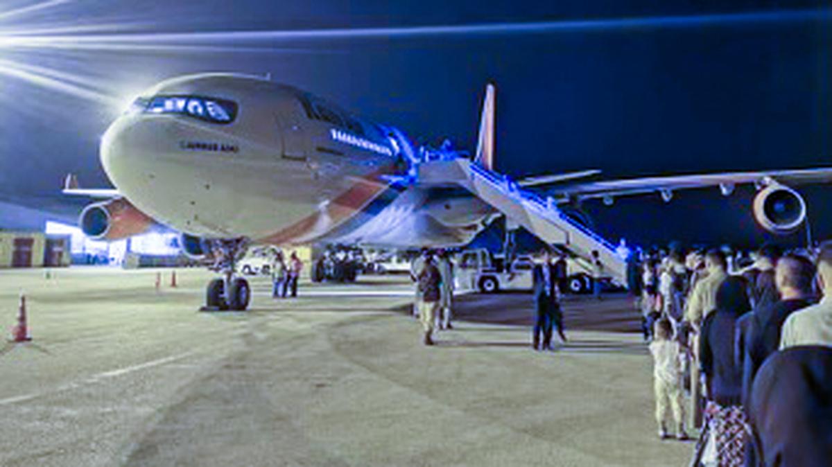 Some 383 Afghans wait to board an Airbus 340 on Sept. 24, 2021, as part of private rescue mission Operation Bella, named for the daughter of Jason Kander of Kansas City.