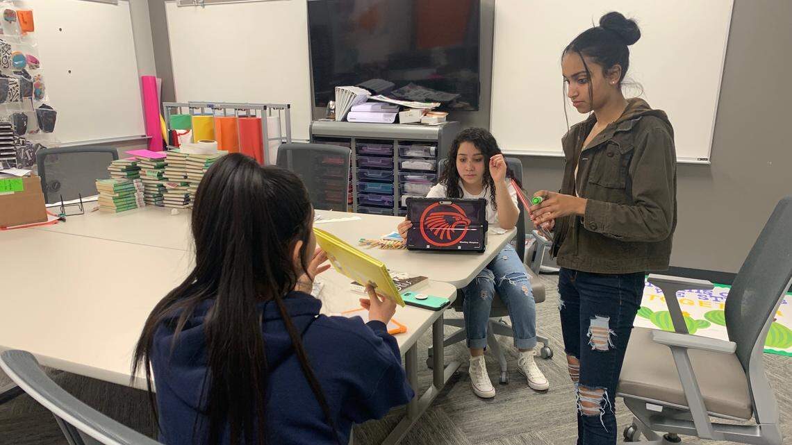 Juniors Sona Patel, left, Clarissa Worley and Stephanie Jamie-Torrecilla work together at the educators academy.