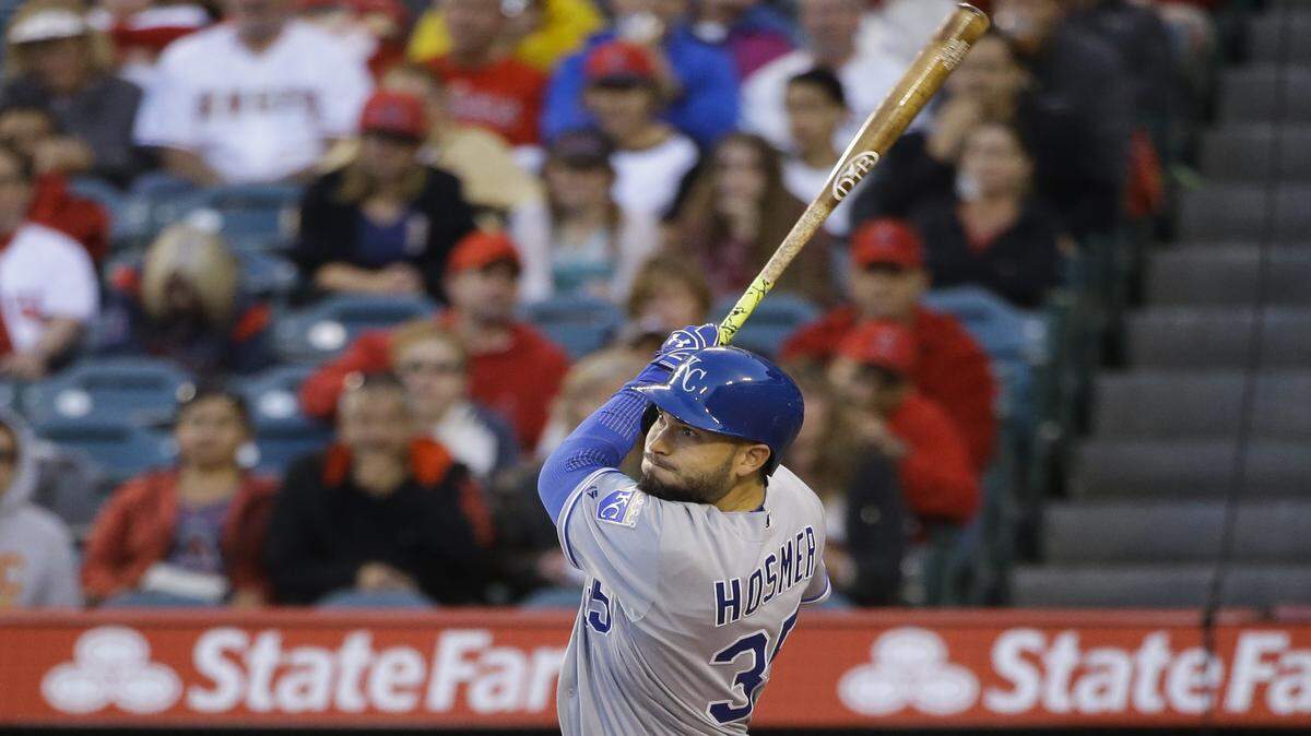 Kansas City Royals' Eric Hosmer follows through on a two-run home run during the first inning of a baseball game against the Los Angeles Angels, Wednesday, April 27, 2016, in Anaheim, Calif. 