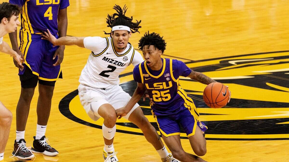 LSU’s Eric Gaines (right) dribbles around Missouri’s Drew Buggs during the game Saturday, March 6, 2021, in Columbia, Mo.