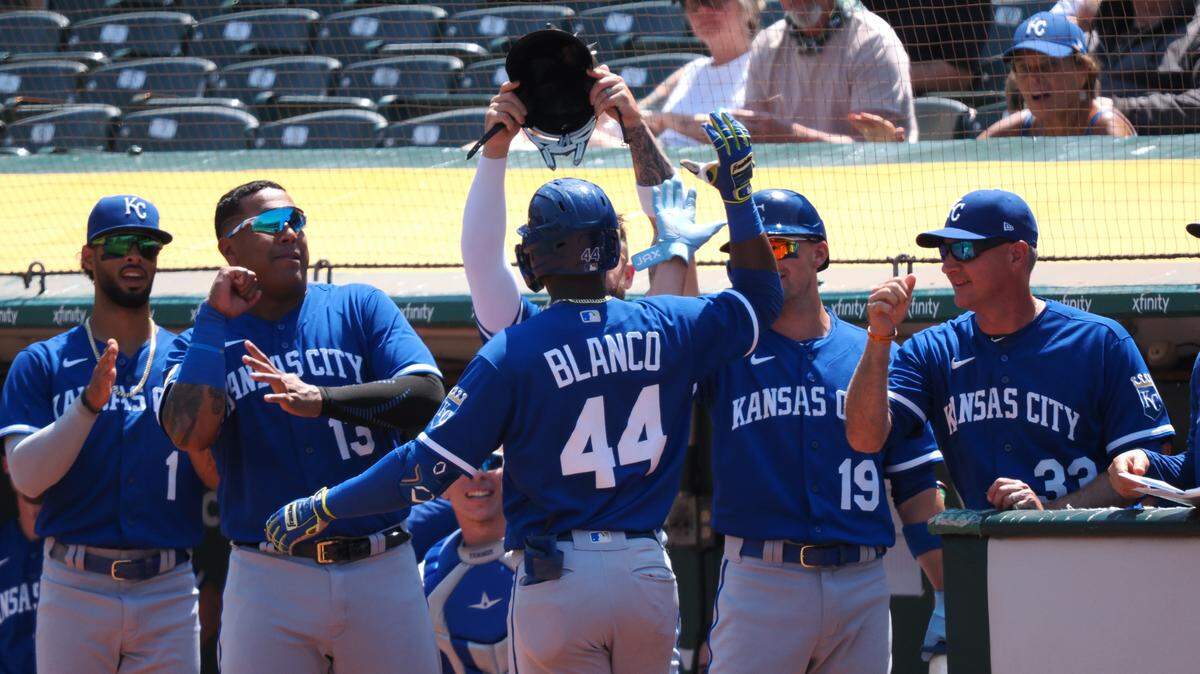 Royals right fielder Dairon Blanco (No. 44) celebrates with teammates after hitting his first major-league homer against his old team on Wednesday in Oakland.