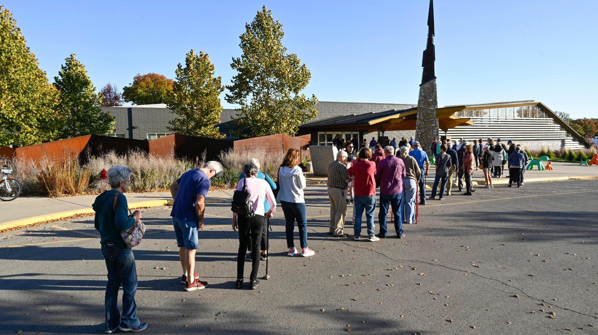 Voters lined up Oct. 22 at the Johnson County Arts and Heritage Center to be some of the first to cast their ballots on the first day of advance voting in Johnson County.