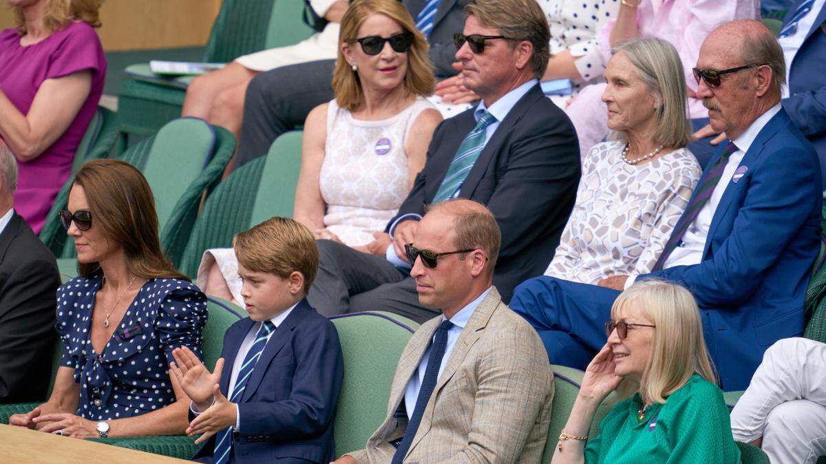 Her royal highness, Duchess of Cambridge, Kate Middleton and Duke of Cambridge, Prince William and Prince George in the Royal Box with former champions Chris Evert and Stan Smith behind them during the men’s singles final on Centre court at All England Lawn Tennis and Croquet Club.