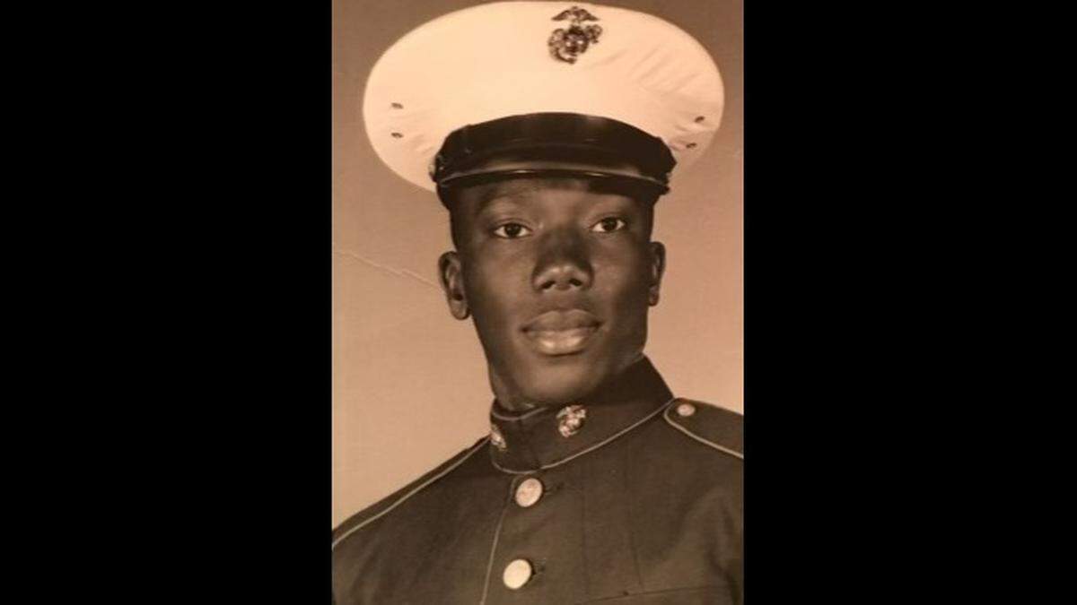 Henry Miller Jr. smiles for his portrait with the Marine Corps. He served for four years, leaving so he could help his mother care for his sick father.
