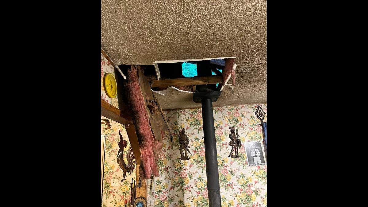 A bear crashed through the ceiling of a home Bell County, Kentucky, officials say.