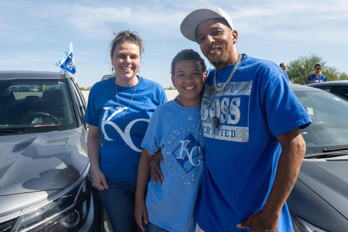 Samantha Hedrick, Stephen Oliver, and their son Satchel, 10, tailgate in the parking lot of Kauffman Stadium prior to the Royals game vs. the Colorado Rockies on Tuesday, April 22, 2025. The group was split on whether they were for or against the Royals building a new stadium downtown.