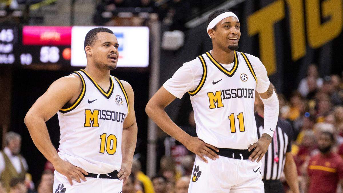 Missouri’s Isiaih Mosley, right, and Nick Honor, left, watch their team shoot free throws during the second half of a game against Iowa State Saturday, Jan. 28, 2023. Missouri won 78-61.