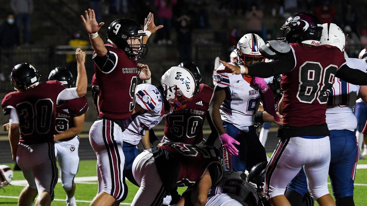 Lawrence junior Truman Juelsgaard gestures after Olathe North junior Noah Palmer failed to run in a 2-point conversion which would have put Olathe North ahead late in the fourth quarter of the game between Olathe North High School and Lawrence High School in Lawrence Friday, Oct. 16, 2020. Lawrence defeated Olathe North 21-20.